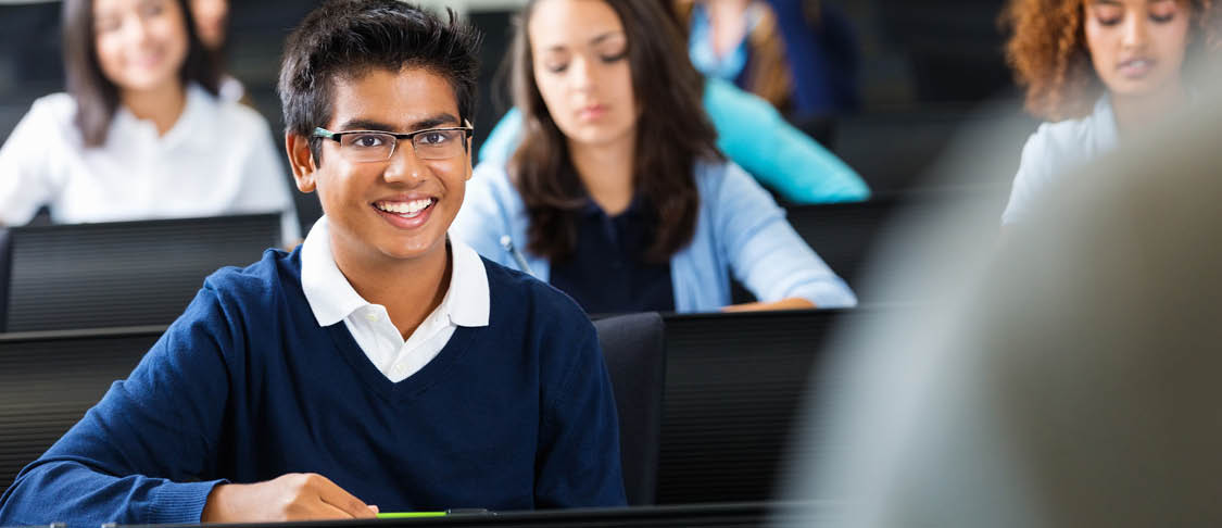 Indian student smiling in classroom